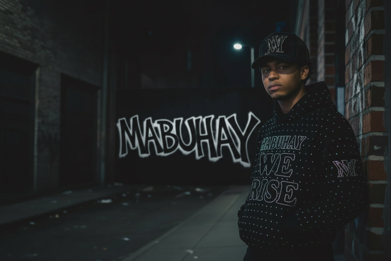 Person wearing a black hoodie with 'We Rise' text on a city street at night.